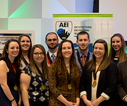 Eight members of the Penn State Architectural Engineering Institute Student Design Competition team pose for a photo